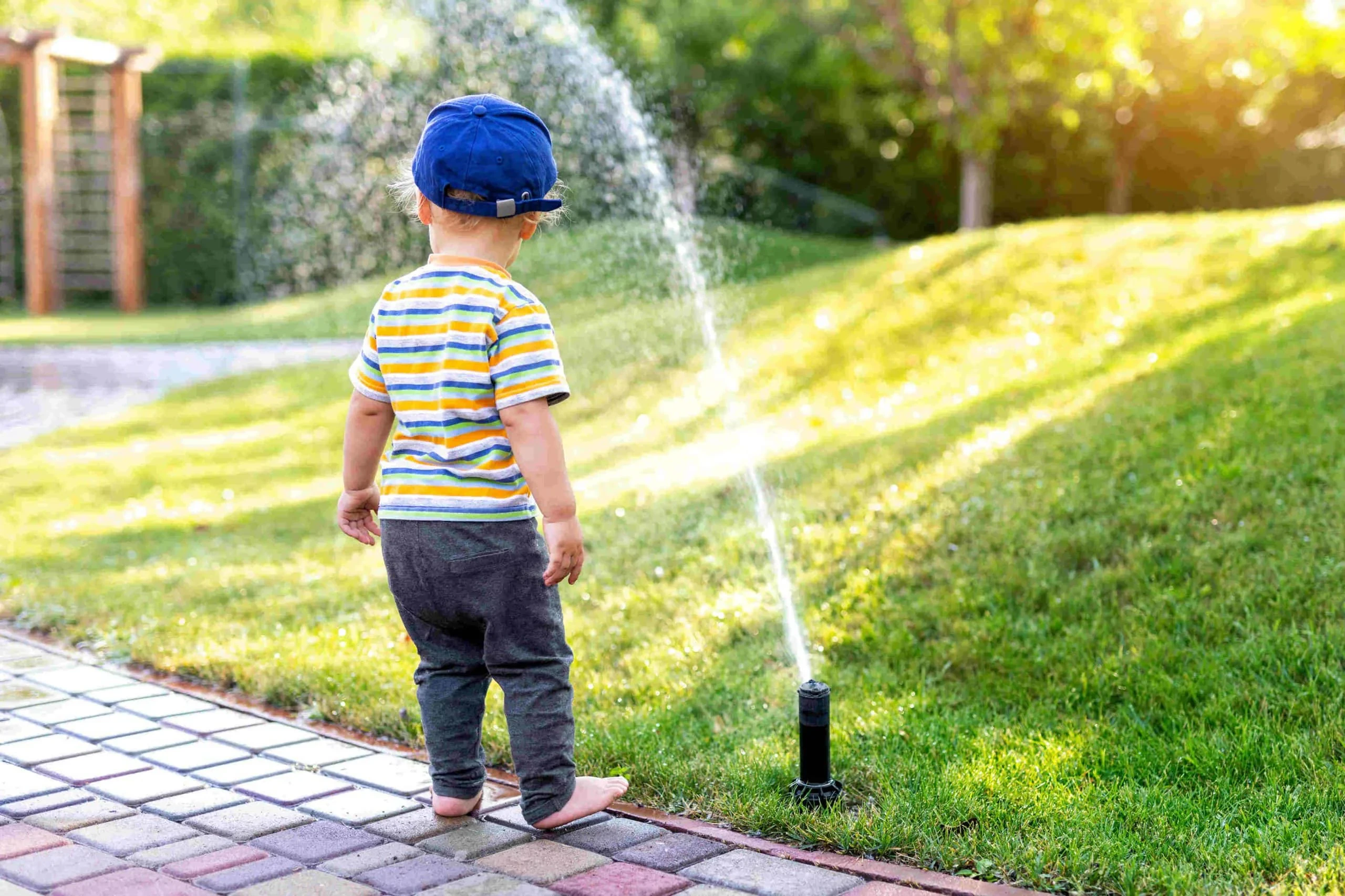 Child Enjoying Sprinkler Fun Mclennan County Texas